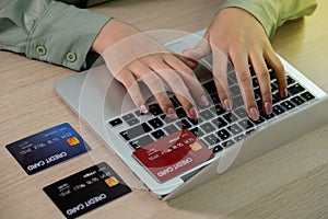 Businesswoman use credit card to online shopping from home with laptop, payment e-commerce, internet banking, spending money for