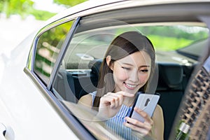 Businesswoman use phone in car