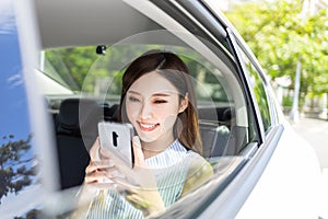 Businesswoman use phone in car