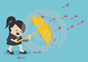 Businesswoman use umbrella to protecting arrow down vector