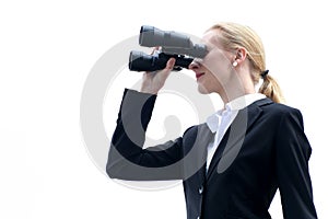 Businesswoman using binoculars