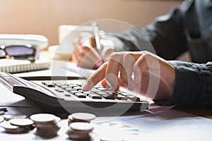 businesswoman using calculator for calculate finance accounting