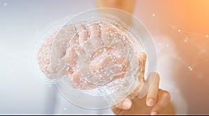 Businesswoman using digital 3D projection of a human brain 3D rendering