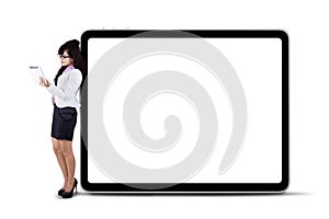 Businesswoman using digital tablet with copyspace
