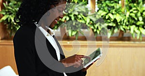 Businesswoman using digital tablet in office