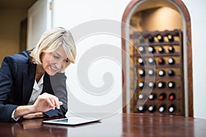 Businesswoman using digital tablet in a restaurant