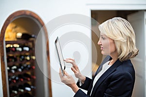 Businesswoman using digital tablet in a restaurant