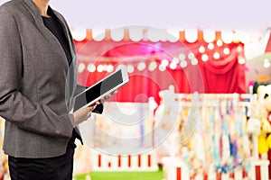 Businesswoman using digital tablet in the shopping mall.