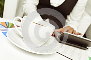 Businesswoman using an electronic calculator in her office