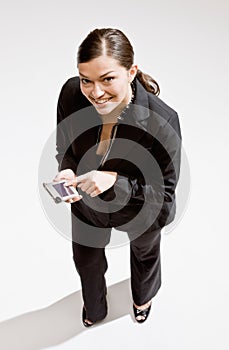 Businesswoman using electronic organizer