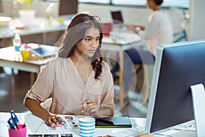 Businesswoman using graphic tablet