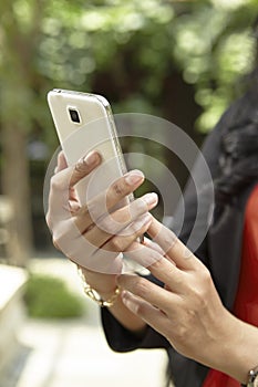 Businesswoman using handphone