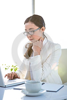 Businesswoman using her laptop pc