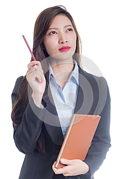 A businesswoman using ideas with her hand holding a pencil and a brown notebook
