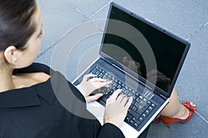 Businesswoman using laptop