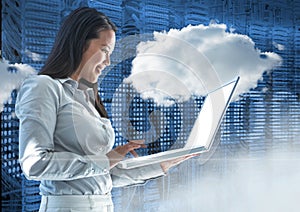 Businesswoman using laptop against web binary code background