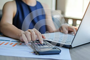 Businesswoman using laptop for analysis maketing plan