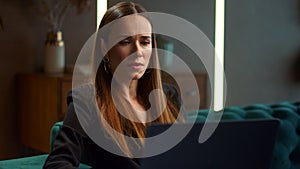 Businesswoman using laptop computer at workplace. Professional working on laptop