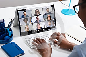 Woman Working From Home Having Group Videoconference photo