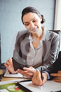 Businesswoman using mobile phone