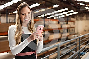 Businesswoman using mobile phone to work and view request at warehouse