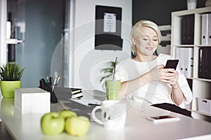 Blonde business woman in the office