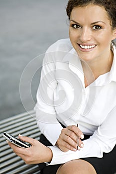 Businesswoman using palmtop