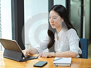 Businesswoman using on portable tablet for online payment