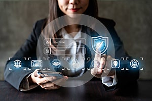 Businesswoman using smart devices with global network connection and cyber security business protection technology