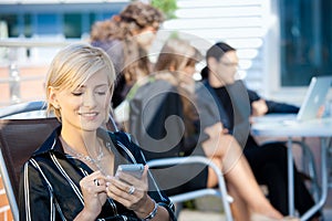 Businesswoman using smart phone photo