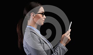 Businesswoman Using Smartphone Face Recognition System On Black Background