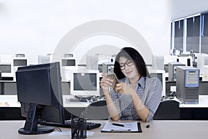 Businesswoman using a smartphone in the workplace