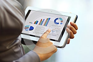 Businesswoman using tablet computer to work