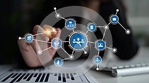 Businesswoman Using Touchscreen Interface for Network Connectivity and Data Visualization in Modern Workspace with