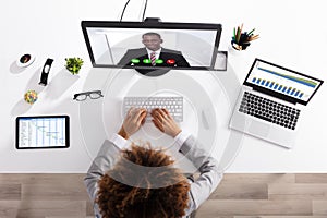 Businesswoman Video Conferencing With Colleague On Computer