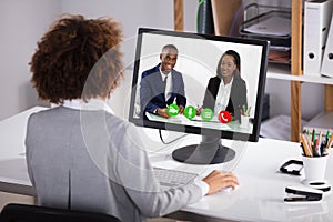 Businesswoman Video Conferencing Colleagues