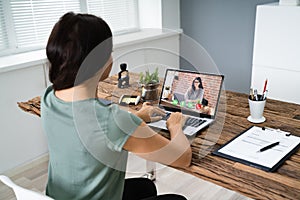 Businesswoman Video Conferencing On Computer