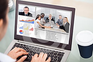 Businesswoman video conferencing with laptop