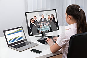 Businesswoman Videoconferencing On Computers