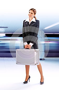Businesswoman waiting for a train in subway