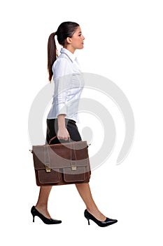 Businesswoman walking with a briefcase