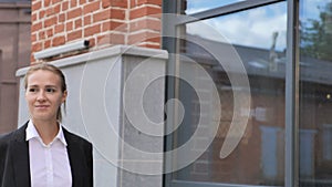 Businesswoman Walking Ouside Office