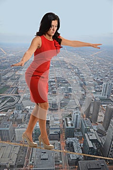 Businesswoman Walking on Tightrope