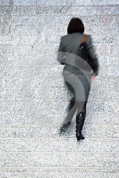 Businesswoman Walking Up Stairs, Motion Blur