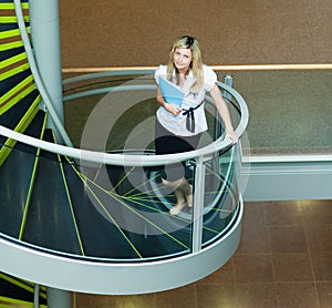 Businesswoman walking up stairs in office