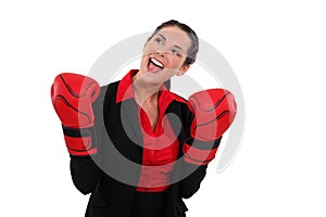 Businesswoman wearing boxing gloves