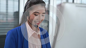 Businesswoman wearing headset working actively in office