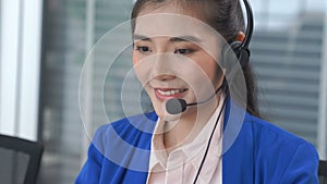 Businesswoman wearing headset working actively in office