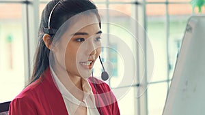 Businesswoman wearing headset working actively in office