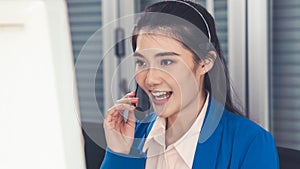 Businesswoman wearing headset working actively in office